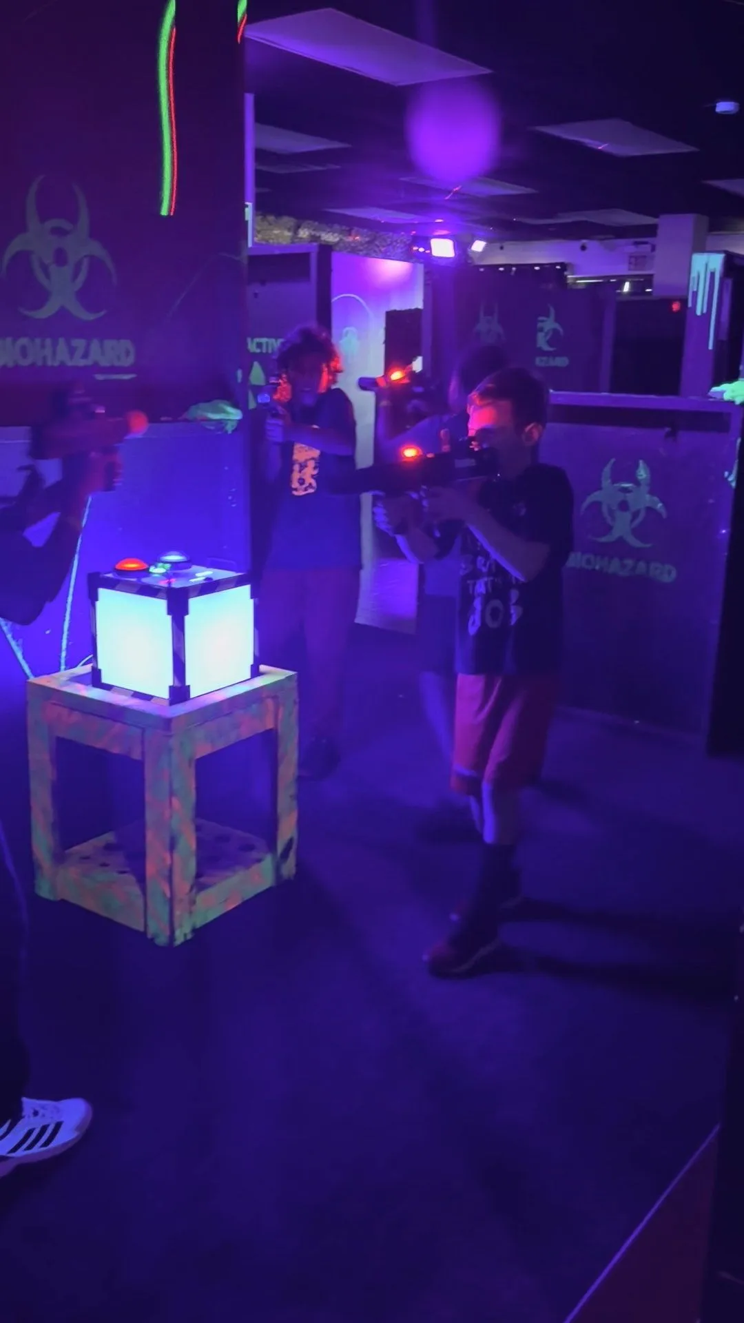 Indoor laser tag arena with a glowing game prop