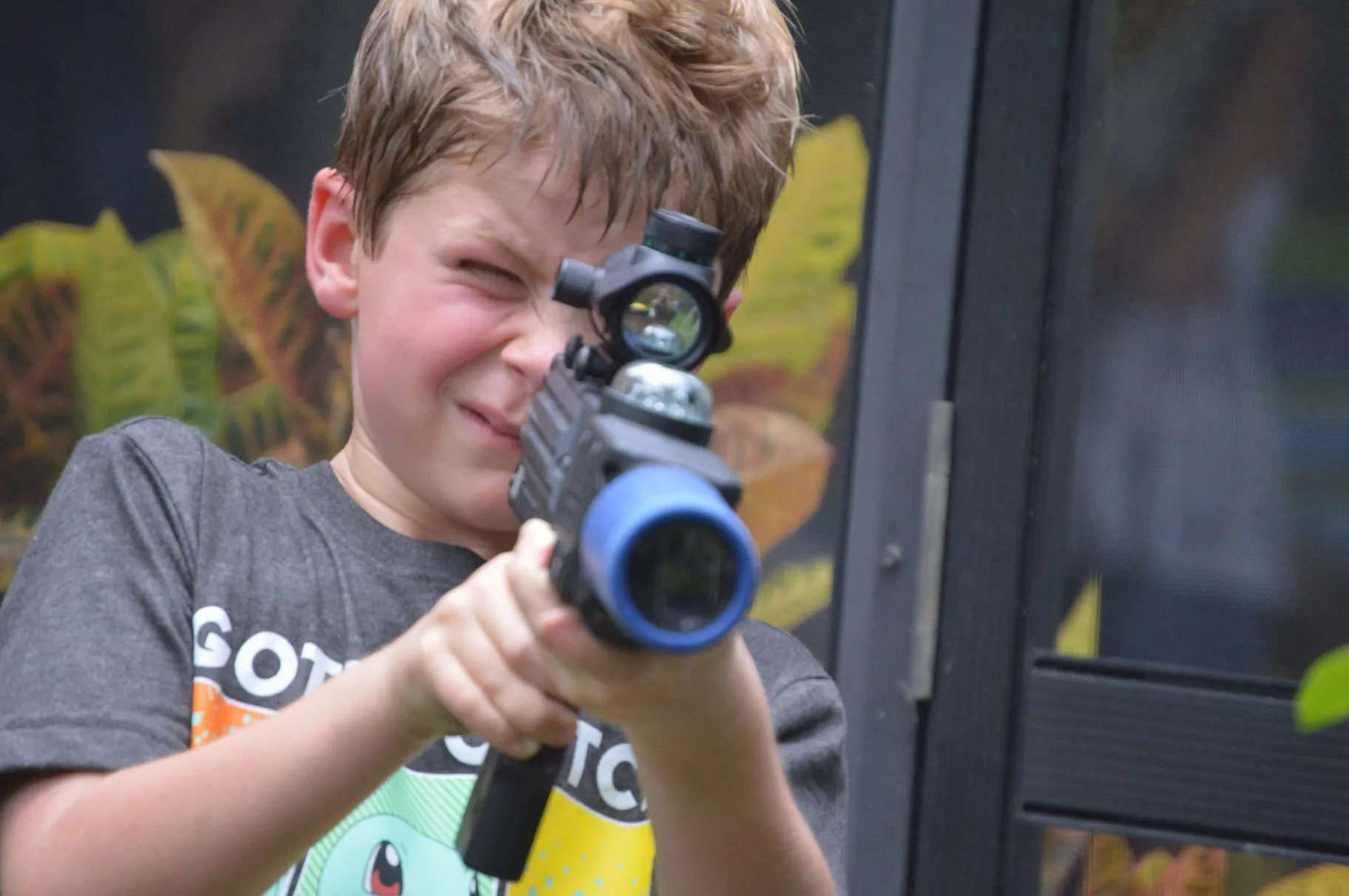 Player aiming a blue-tipped tagger